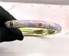 bracelet joncs en émail violet à motif floral