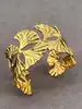 bracelet manchette motif feuille de ginkgo en acier doré