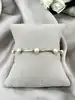 bracelet métal doré avec perles synthétique