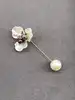 broche fleur avec oxydes et perles synthétiques