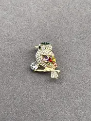 broche oiseau sur branche pavé d'oxydes