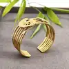 brpi bracelet jonc ouvert en acier, alliant une forme ondulée à un effet de mailles multilignes