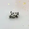 charm pandora love manuscrit  argent 925 millième (22 ct) 1,87g