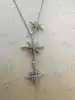 collier apm monaco triple météorites serti d'oxydes de zirconium argent 925 millième (22 ct) 6,82g