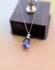 collier en or blanc avec pendentif tanzanite surmontée d'un diamant or 750 millième (18 ct) 2,63g