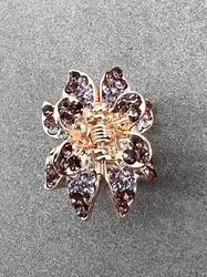 pince à cheveux violet pavé d'oxydes en métal doré