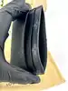 porte-cartes double louis vuitton en toile monogram éclipse et cuir noir