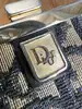 porte-monnaie christian dior vintage en toile oblique avec un fermoir clip doré