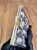 porte-monnaie christian dior vintage en toile oblique avec un fermoir clip doré