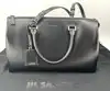sac à main jil sander en cuir lisse noir avec bandoulière et finitions argentées