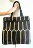 sac cabas agnès b denise en nylon recyclé tressé noir et beige