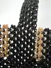 sac cabas agnès b denise en nylon recyclé tressé noir et beige