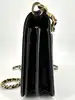 sac pochette coach en cuir grainé noir, chîne dorée détachable