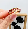 bague or motifs ajourés sertie de 9 rubis et 9 petits diamants or 750 millième (18 ct) 3,85g