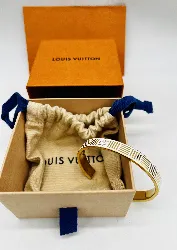 bracelet jonc louis vuitton en métal doré et émail blanc