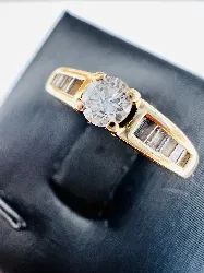 bague diamant env 0,18ct épaulé des diamants baguettes or 750 millième (18 ct) 2,84g