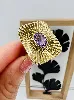 bague rectangulaire motif rayonnant centrée d'une améthyste (rayée)  or 585 millième (14 ct) 7,71g