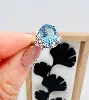 bague argent topaze bleue épaulée de 2 lignes d'oxydes argent 925 millième (22 ct) 2,52g