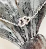 bracelet fine 2 coeurs entrelacés dont un pavé d'oxydes argent 925 millième (22 ct) 1,16g