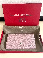 lancel grand compagnon / pochette remember me en cuir couleur rose pâle