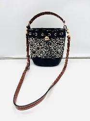 tory burch mini sac seau en jacquard t°monogram (2 fissures sur la doublure à l'intérieur)