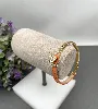 bracelet guess en acier doré et cuir orange orné d'un coeur en strass