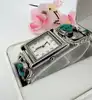 montre harpo paris en argent massif et turquoises mouvement quartz avec cadran rectangulaire et bracelet extensible en acier inoxy
