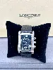 montre longines dolcevita l5 656.4 boitier rectangulaire en acier, 3.2 x 4,2 cm, fond noir, chiffres romains avec le braclet rappo