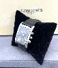 montre longines dolcevita l5 656.4 boitier rectangulaire en acier, 3.2 x 4,2 cm, fond noir, chiffres romains avec le braclet rappo