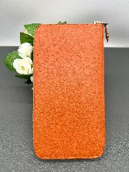 portefeuille hermès silk'in classique en cuir orange et doublure en twill de soie imprimé