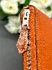 portefeuille hermès silk'in classique en cuir orange et doublure en twill de soie imprimé