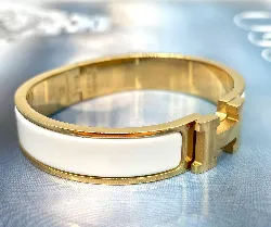 bracelet hermès clic h en métal doré et émail blanc