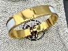 bracelet hermès clic h en métal doré et émail blanc