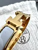 bracelet hermès clic h en métal doré et émail blanc