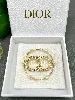 broche dior clair d lune en métal finition dorée, perles en résine blanche et cristaux blancs