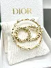 broche dior clair d lune en métal finition dorée, perles en résine blanche et cristaux blancs