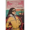 livre fantomette contre la main jaune