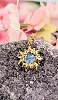 pendentif soleil avec une pierre bleue sculptée  or 750 millième (18 ct) 1,49g