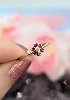bague petite fleur ornée d'un petit diamant et  6 rubis or 375 millième (9 ct) 1,33g