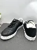 baskets tennis chanel en cuir noir avec logo cc
