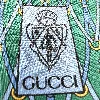 cravate gucci fond vert à motifs équestre