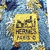 cravate hermès 100% soie fond bleu à motifs de palmiers
