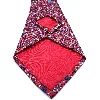 cravate hermès 100% soie rouge à motifs géométriques et fleurs de lys bleues