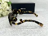 lunettes de soleil prada swirl pr270s avec les verres marron dégraté et les branches branches sculptées