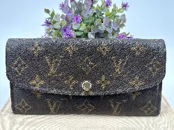 portefeuille louis vuitton émilie long en toile monogram et l'intérieur en cuir de veau grainé rouge