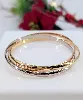 bracelet jonc cartier trinity modèle classique en 3 ors or 750 millième (18 ct) 59,54g