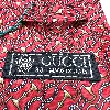 cravate gucci 100% soie motifs équestres sur fond rouge