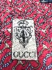 cravate gucci 100% soie motifs équestres sur fond rouge