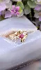 bague en 2 ors centrée d'un rubis et 2 petits diamants or 750 millième (18 ct) 2,51g