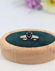 bague en 2 ors centrée d'une améthyste en cabochon épaulé de 2 petits diamants or 750 millième (18 ct) 2,08g